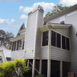 exterior rear of house with windows siding and gutters