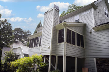 exterior rear of house with windows siding and gutters
