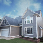 front of gray home with new siding and gutters